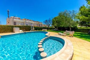 een zwembad voor een huis bij HE La Florida-David in Orihuela-Costa