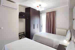 Ένα ή περισσότερα κρεβάτια σε δωμάτιο στο Metaxenia's apartment 201