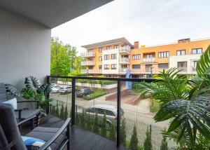 a balcony with a view of a parking lot at Apartament Morski Spokój Solny Resort in Kołobrzeg