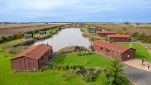 an aerial view of a river next to buildings at Lakeside Fishing Cabins in Boston