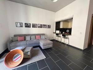 a living room with a couch and a table at Bosa Apartments Episcopio 1 in Bosa