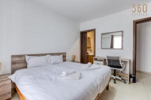 A bed or beds in a room at Charming & Central 3BR Apt with Private Terrace by 360 Estates