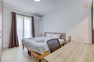 A bed or beds in a room at Charming & Central 3BR Apt with Private Terrace by 360 Estates