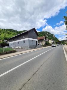 a building on the side of a road at No name in Jajce
