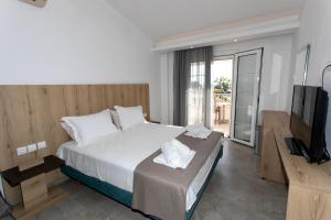 Postel nebo postele na pokoji v ubytování Hotel Philoxenia