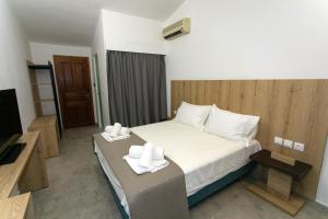 Postel nebo postele na pokoji v ubytování Hotel Philoxenia