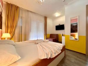 Postel nebo postele na pokoji v ubytování Hotel Nur