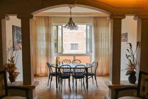 a dining room with a table and chairs at Spacious Apart, 2-min to beach & Old Souk in Jbeil