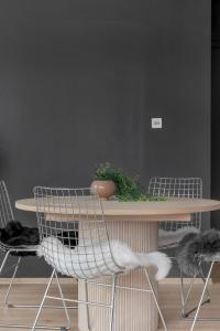 two chairs and a table with a plant on it at The Arctic Urban Cityscape in Tromsø +26 photos