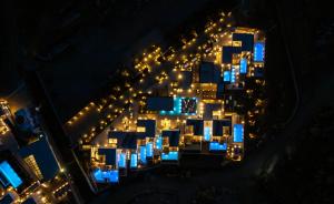 an aerial view of a city at night at Amyth of Mykonos Super Paradise in Super Paradise Beach