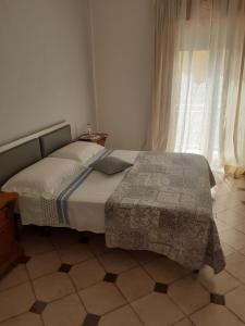 Letto o letti in una camera di Casa dello Scoglio nel mare