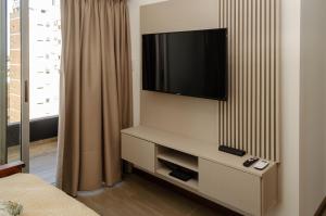 a room with a flat screen tv on a wall at N3 - Irigoyen 2 in Villa Constitución
