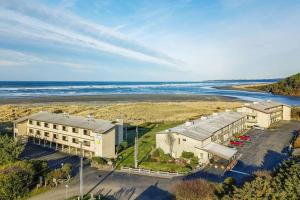 an aerial view of a building next to the ocean at Finch's Sunset Condo #16 in Moclips