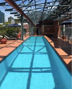 a large swimming pool on top of a building at Waterkant Loft in Cape Town