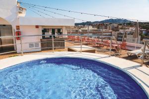 a hot tub on the balcony of a building at htop Amatista #htopBliss in Lloret de Mar