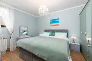 Postel nebo postele na pokoji v ubytování Ston apartment Sagittarius