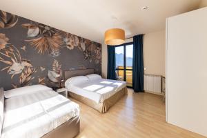 Posteľ alebo postele v izbe v ubytovaní Hotel Miranda