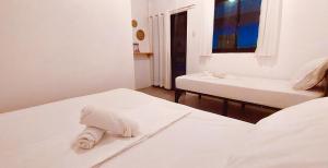 Postel nebo postele na pokoji v ubytování Camotes Hostel Resort