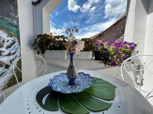 a vase sitting on a table on a table at Apartments Mehić in Mostar