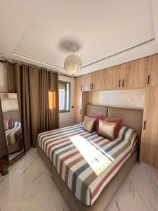 Postelja oz. postelje v sobi nastanitve Charmant appartement avec Vue Imprenable sur la Méditerranée