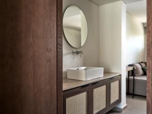 a bathroom with a sink and a mirror at Admiral De Luxe in Zakynthos +10 photos