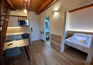 Posteľ alebo postele v izbe v ubytovaní Apartamentos La Solana