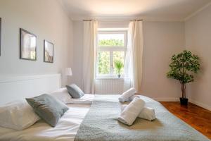 Posteľ alebo postele v izbe v ubytovaní Florianska Gate Luxury Apartments