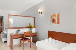 Postel nebo postele na pokoji v ubytování Ariti Grand Hotel