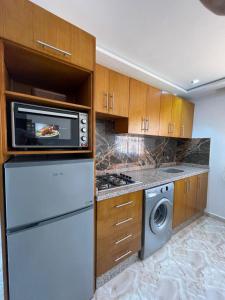Kuchyň nebo kuchyňský kout v ubytování Hiba apartments