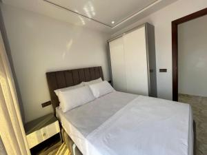 Postel nebo postele na pokoji v ubytování Hiba apartments
