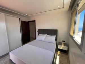 Postel nebo postele na pokoji v ubytování Hiba apartments