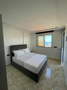 Postel nebo postele na pokoji v ubytování Hiba apartments