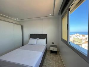Postel nebo postele na pokoji v ubytování Hiba apartments