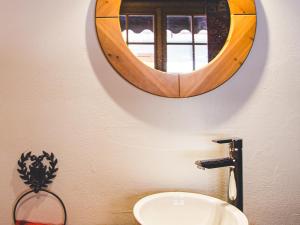 a bathroom with a mirror and a sink at Appartement 3 chambres, cheminée, balcon, centre Les Gets, près des pistes et commodités - FR-1-671-14 in Les Gets