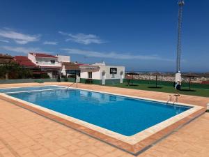 a large swimming pool in the middle of a building at Thader I Apartment with views in Rojales