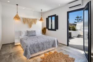 Katil atau katil-katil dalam bilik di Terra Vecchia Suites