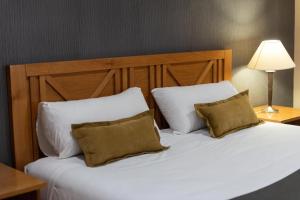 Cama ou camas em um quarto em Hotel Canal Beagle