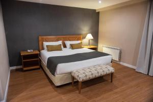 Cama ou camas em um quarto em Hotel Canal Beagle