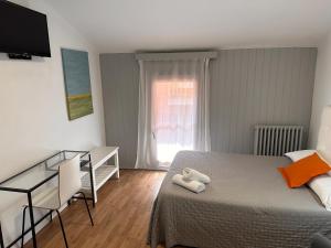 Posteľ alebo postele v izbe v ubytovaní Hostal ARS