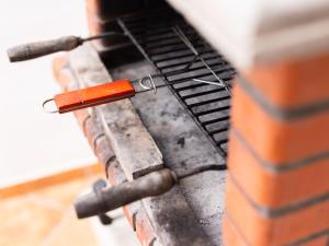 a hot dog on top of a grill at Live Arico El Cortijo Casa Rural con Solarium y Terraza in Arico Viejo