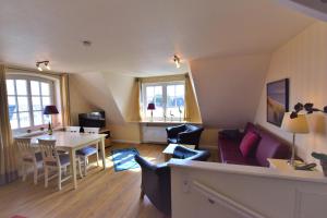 Χώρος καθιστικού στο Landhaus auf der Düne, App 7