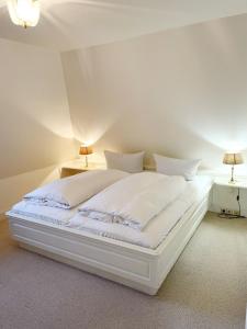 Postel nebo postele na pokoji v ubytování Hellas Hüs