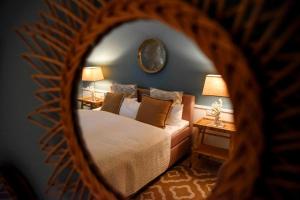 a bedroom with a bed and two tables with lamps at Strandhaus in Rantum
