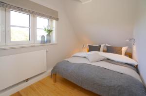 En eller flere senge i et værelse på Haus Rystsandt