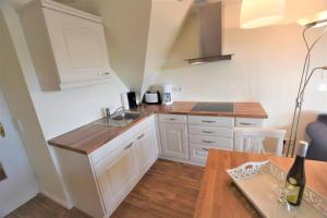 Kuchyň nebo kuchyňský kout v ubytování Landhaus Ruusenhüs, App 3 + 2 fotografie