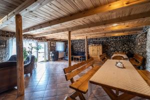 a room with a table with a cat sitting on it at AgroGabi - Wypoczynek na Podlasiu in Burniszki