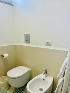 a bathroom with a toilet and a sink at B&B L'Agapanto in Capri
