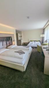 Postel nebo postele na pokoji v ubytování Hotel Gierer