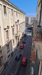 a view of a street with cars parked on the street at Duomo Luxury Suite Catania in Catania