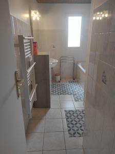 a bathroom with a toilet and a sink and a tub at Chez Suzanne Maison à la campagne 2-8pers 4 chambres in Longeville-sur-la-Laines +55 photos